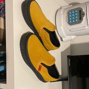 Black and Yellow slip on Vans